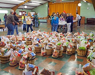 People filling baskets with food